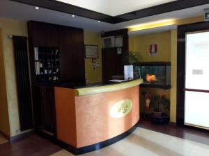 a bar in a lobby with a fish tank at Albergo Sonia in Florence