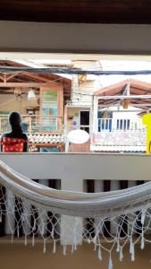 a reflection of a person on a boat in a mirror at Cantinho da Luna in Morro de São Paulo