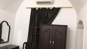 a door in a room with a curtain at Sunny sky in Quseir