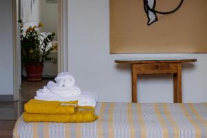 En eller flere senge i et værelse på Casa D'artista - charming apartment + Parking