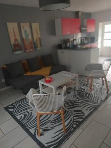 a living room with a table and a couch at home ferman in Saint-Dyé-sur-Loire