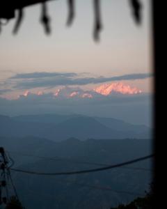 a view of a mountain range in the distance at MiakaHillsDarjeeling in Darjeeling