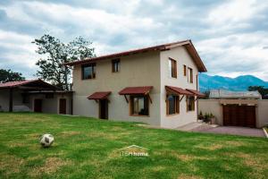 a house with a soccer ball in the yard at ItsaHome Vacations - Casa de Campo Atuntaqui 
