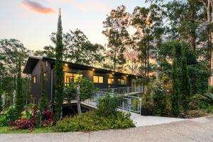 a house in the woods with trees at Gold Coast Tree Houses in Neranwood