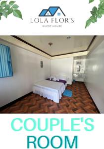 1 dormitorio con 1 cama en una habitación en Lola Flor's Guest House en El Nido