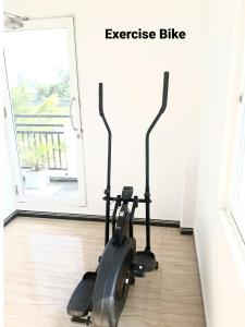 an exercise bike on the floor in front of a door at Blue Diamond Resort in Trincomalee