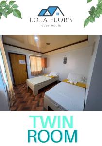 um quarto com 2 camas e um quarto com 2 camas individuais em Lola Flor's Guest House em El Nido