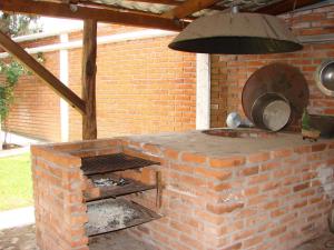 an outdoor brick oven in a brick wall at Los Ócalos Villas in Huasca de Ocampo