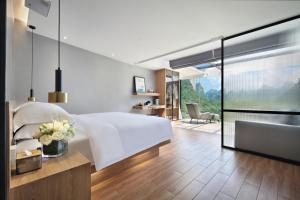 Postel nebo postele na pokoji v ubytování Lanshan Moon Resort
