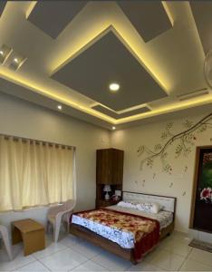 Tempat tidur dalam kamar di Orchid Ranipuram