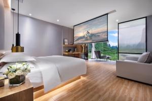 Postel nebo postele na pokoji v ubytování Lanshan Moon Resort