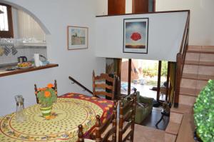 a kitchen with a table with a vase on it at Beach House Casa Erica in Ampurias +27 photos