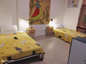 Postel nebo postele na pokoji v ubytování ㄧ個背包客棧