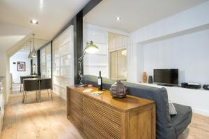 a living room with a couch and a table at BmyGuest - Castelo Charming Flat in Lisbon