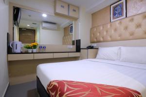 Letto o letti in una camera di Sandpiper Hotel Singapore