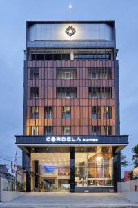 a building with a sign on the front of it at Cordela Suites Tasikmalaya in Tasikmalaya