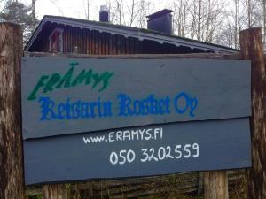 a sign for a park with graffiti on it at Kultala Cottage in Korkeakoski