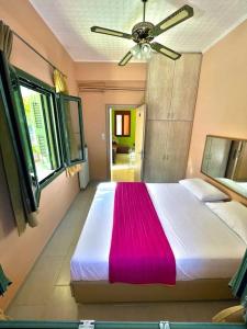 Ένα ή περισσότερα κρεβάτια σε δωμάτιο στο Villa Simotas 4 Four