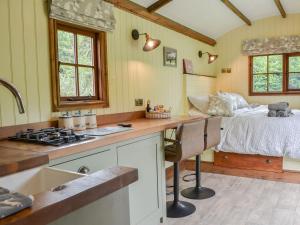 a kitchen with a bed and a sink in a room at Mayflower - Uk41003 in Pocklington