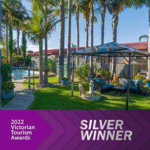 a flyer for a silver winner with palm trees at Sandbar Motel in Lakes Entrance