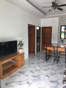 A television and/or entertainment centre at Villa MILTONIA