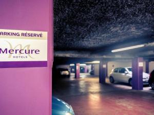 a parking garage with cars parked in it at Mercure Lille Centre Vieux Lille in Lille