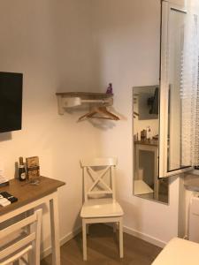TV a/nebo společenská místnost v ubytování B&B Via dell'Azzurra