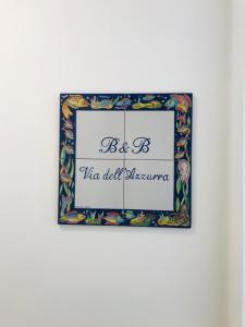 a picture frame with a sign that reads be the oldestgeneration at B&B Via dell'Azzurra in Bari