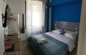 Postel nebo postele na pokoji v ubytování B&B Via dell'Azzurra