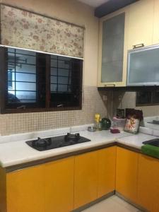 a kitchen with a sink and a window at Private single room in Cigadung in Bandung