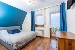 Postel nebo postele na pokoji v ubytování Pokoje Gościnne Roztoka