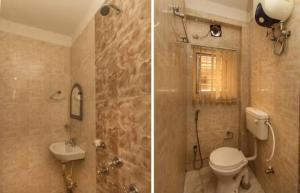 a bathroom with a shower and a toilet and a sink at Skyline Lodge in Siliguri