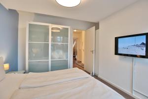 Postel nebo postele na pokoji v ubytování Strandduene Stranddüne Appartement 23