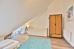 Postel nebo postele na pokoji v ubytování Strandduene Stranddüne Appartement 23