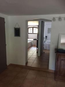 a hallway with a room with two beds and a mirror at Bandol T3 RDJ Plage 5 mn à pied-Port 10 Mn-Parking in Bandol