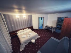 Postel nebo postele na pokoji v ubytování Pensiunea Crescent Predeal