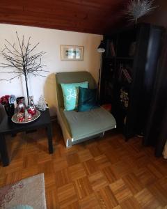 a living room with a couch and a table at Roba's Apartment in Zagreb