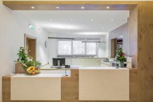 a kitchen with a counter with a bowl of fruit on it at Alpine Club, Austria 