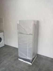 a refrigerator wrapped in plastic in a room at Дом рядом проспекта Исакова, 3 км Звартноц аэропорт EVN in Geghanist