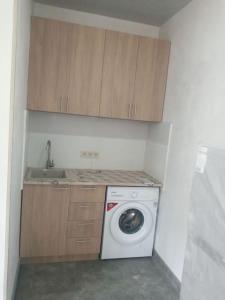 a kitchen with a washing machine and a sink at Дом рядом проспекта Исакова, 3 км Звартноц аэропорт EVN in Geghanist