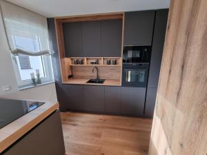 Kuchyň nebo kuchyňský kout v ubytování Apartment Deluxe Ossiacher See - Gerlitzen