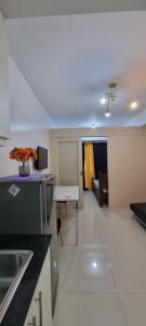 a room with a kitchen and a living room at EZBeds Sea Residences TowerE in Manila