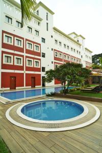 a swimming pool in front of a building at HOTEL ANNAPURNA in Vishnupur