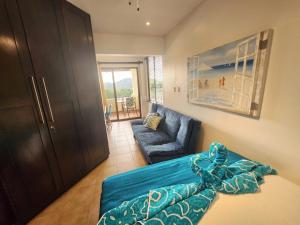a living room with a couch and a couch and a chair at Amazing Oceanview rooftop terrace walk to beach in Coco +36 photos