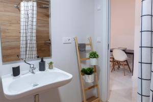 a bathroom with a white sink and a shower at Artistic Digital Retreat-Great Location Near Metro in Valencia