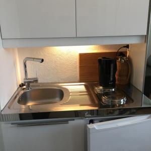 Η κουζίνα ή μικρή κουζίνα στο Mini Apartment +34 φωτογραφίες
