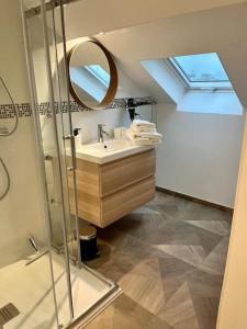 a bathroom with a sink and a mirror at Champagne stars in Épernay +18 photos
