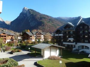 a view of a town with a mountain in the background at Samoëns studio in Samoëns