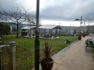 a park with a gazebo in the grass at Hotel Naval do Espiño in Donsión