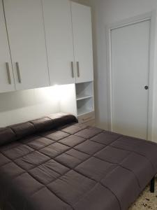 Posteľ alebo postele v izbe v ubytovaní Qube Apartment